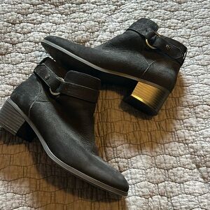 Black shorty boots with buckke accent